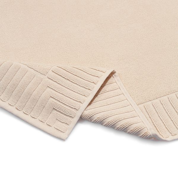 Коврик для ванной с фактурным бортиком кремового цвета из коллекции essential, 50x80 см Tkano